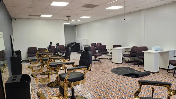 a room with furniture a rug and a flat screen tv
