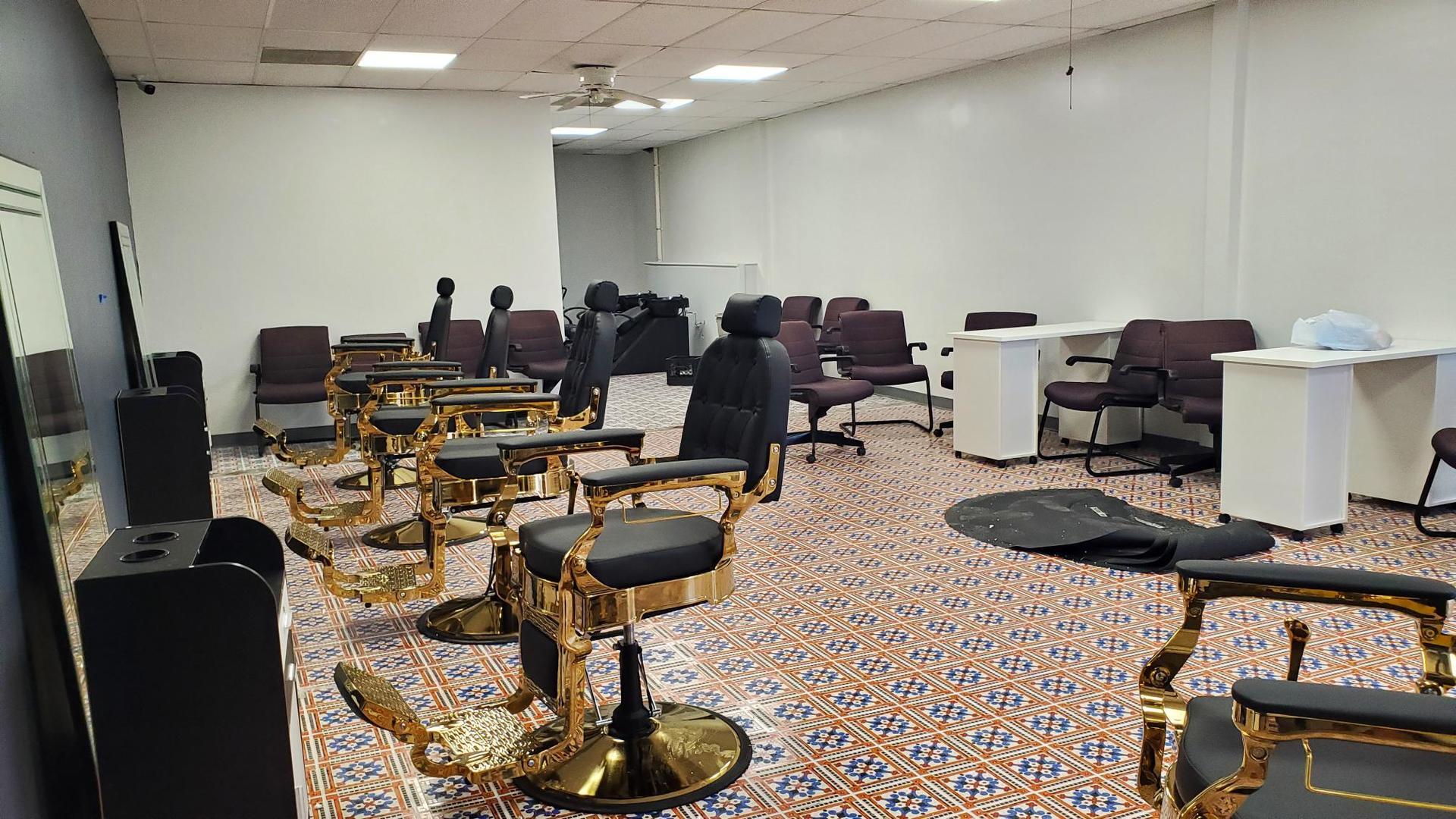 983 West Wise Road, Unit 983 Schaumburg, IL 60193 - Photo 12 of 13 a room with furniture a rug and a flat screen tv