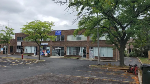 a view of a car park in front of building