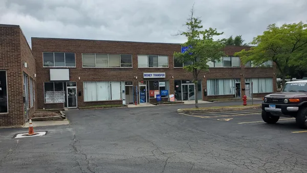 a view of street with parked cars