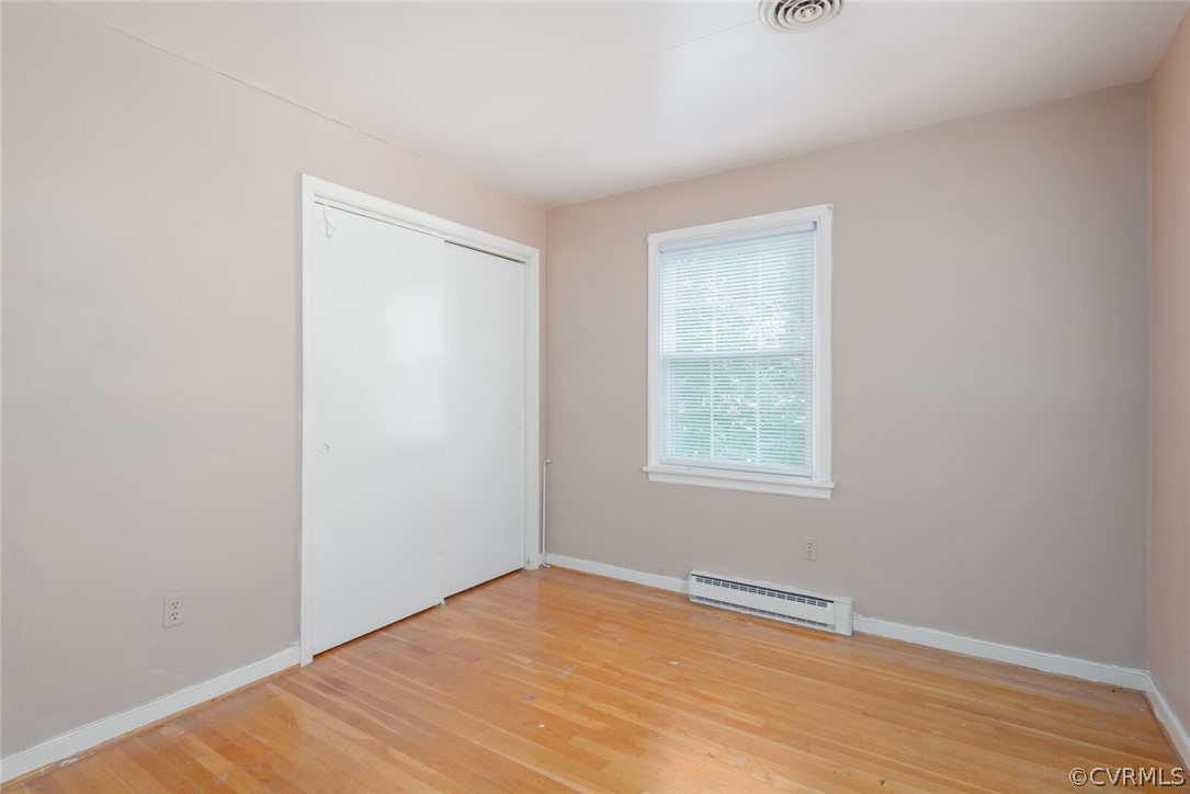 3617 Frontier Drive Richmond, VA 23225 - Photo 30 of 38 a view of an empty room with wooden floor and a window