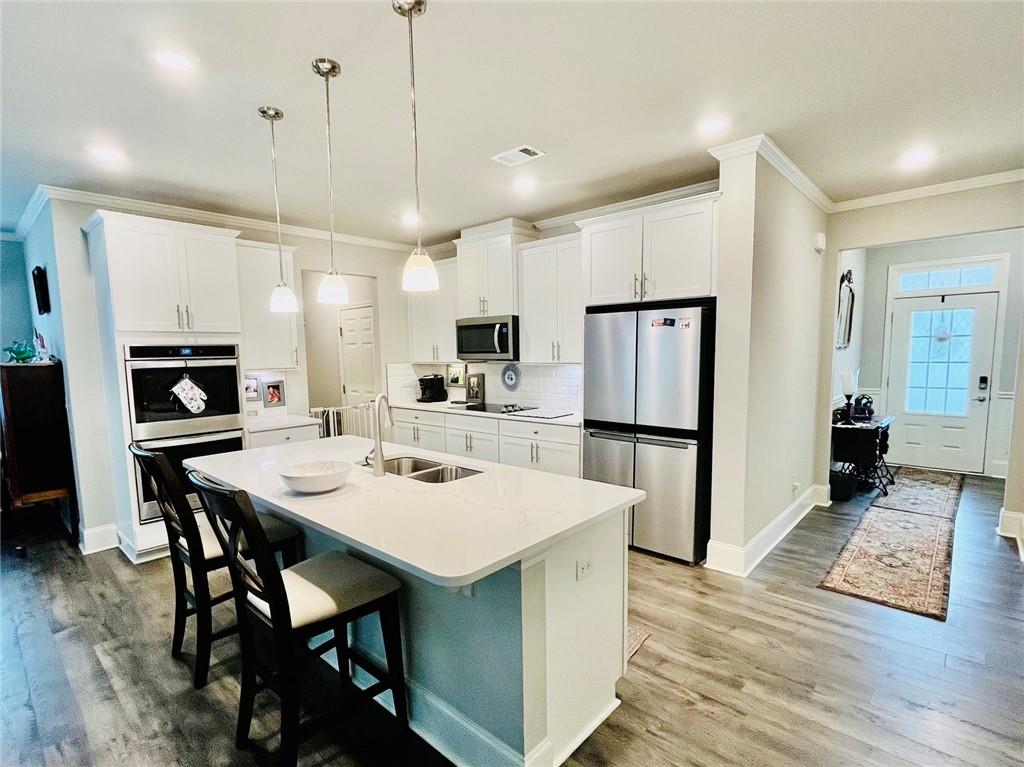 3015 Winding Ridge Waleska, GA 30183 - Photo 8 of 40 a large kitchen with a table and chairs