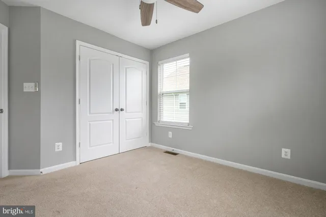 a view of a house with a yard and porch