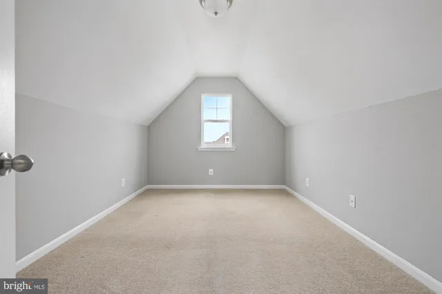 an aerial view of a house with a big yard