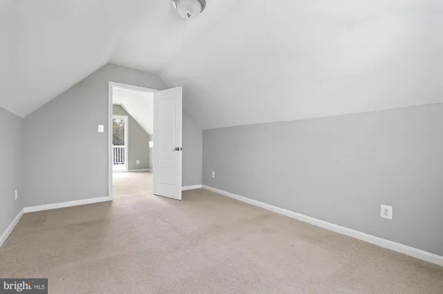 a view of a lake with houses in the back