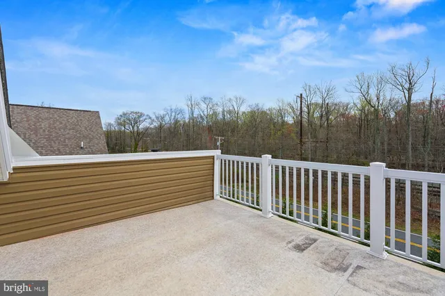 a aerial view of a house with a yard table and chairs