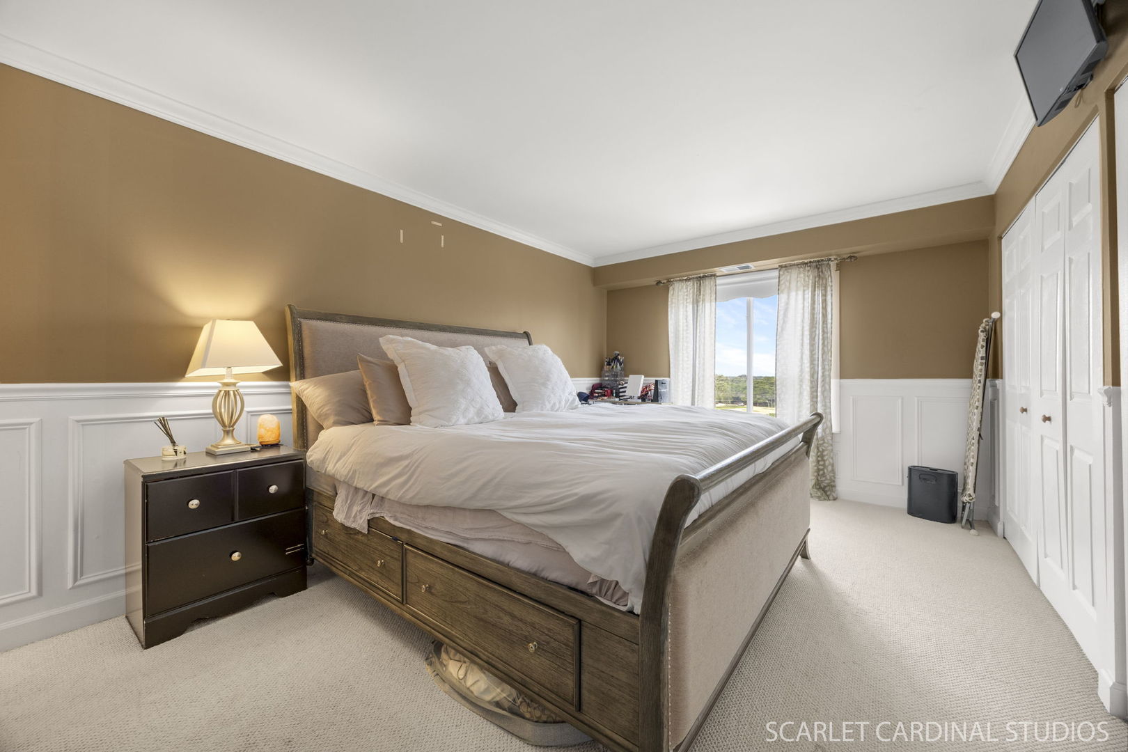 5400 Walnut Avenue, Unit 805 Downers Grove, IL 60515 - Photo 2 of 10 a spacious bedroom with a bed and a cabinets