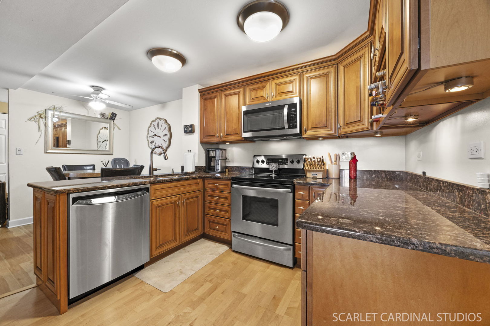 5400 Walnut Avenue, Unit 805 Downers Grove, IL 60515 - Photo 7 of 10 a kitchen with stainless steel appliances granite countertop a stove sink microwave and cabinets