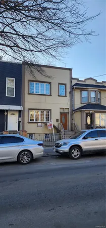 a front view of a house with parking space