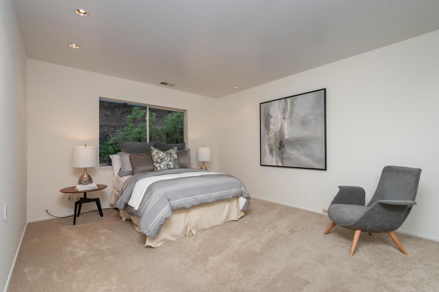 210 Hardwick Road Woodside, CA 94062 - Photo 16 of 29 a bedroom with bed and a chair