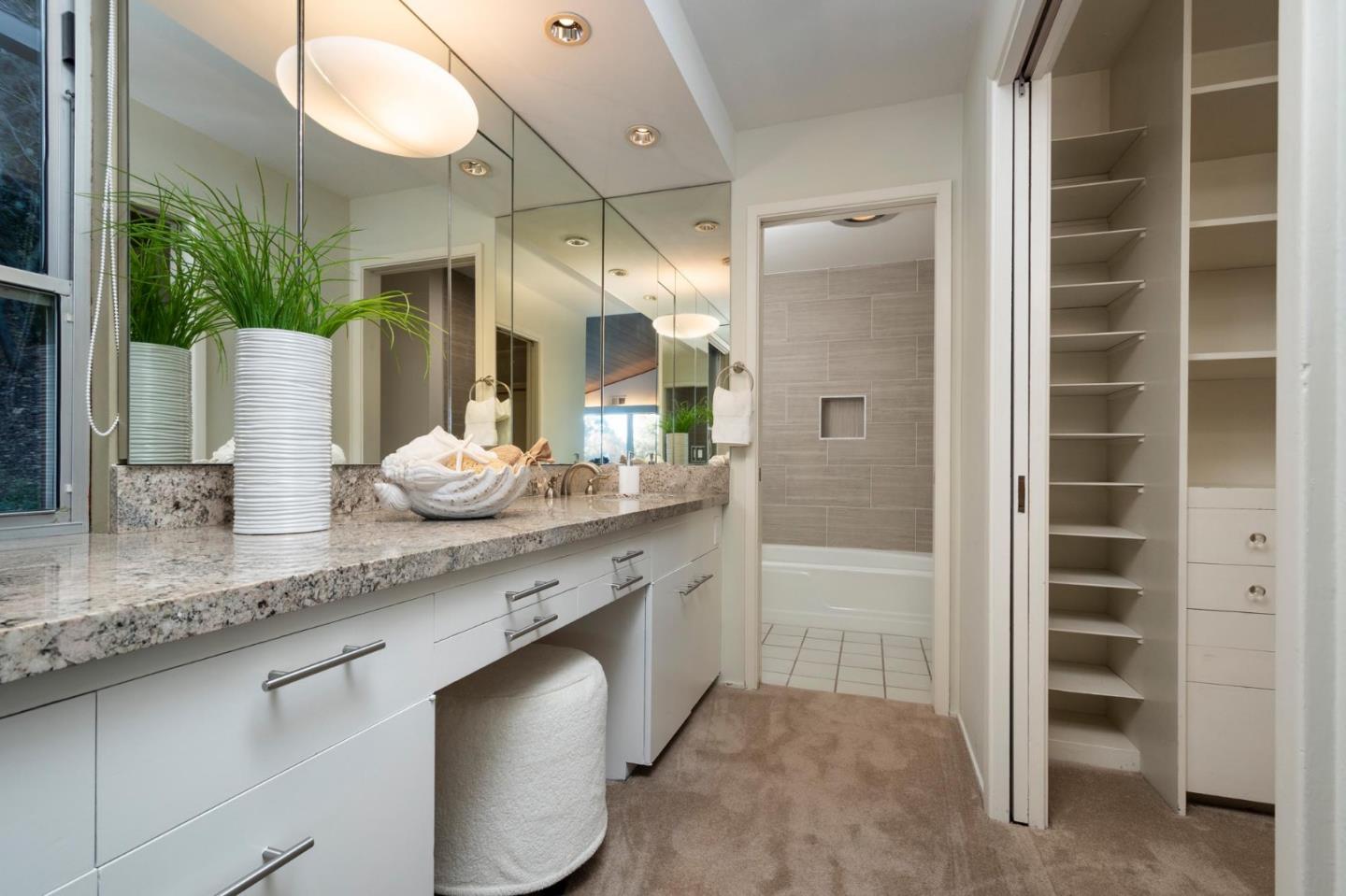 210 Hardwick Road Woodside, CA 94062 - Photo 17 of 29 a bathroom with a granite countertop sink and a mirror