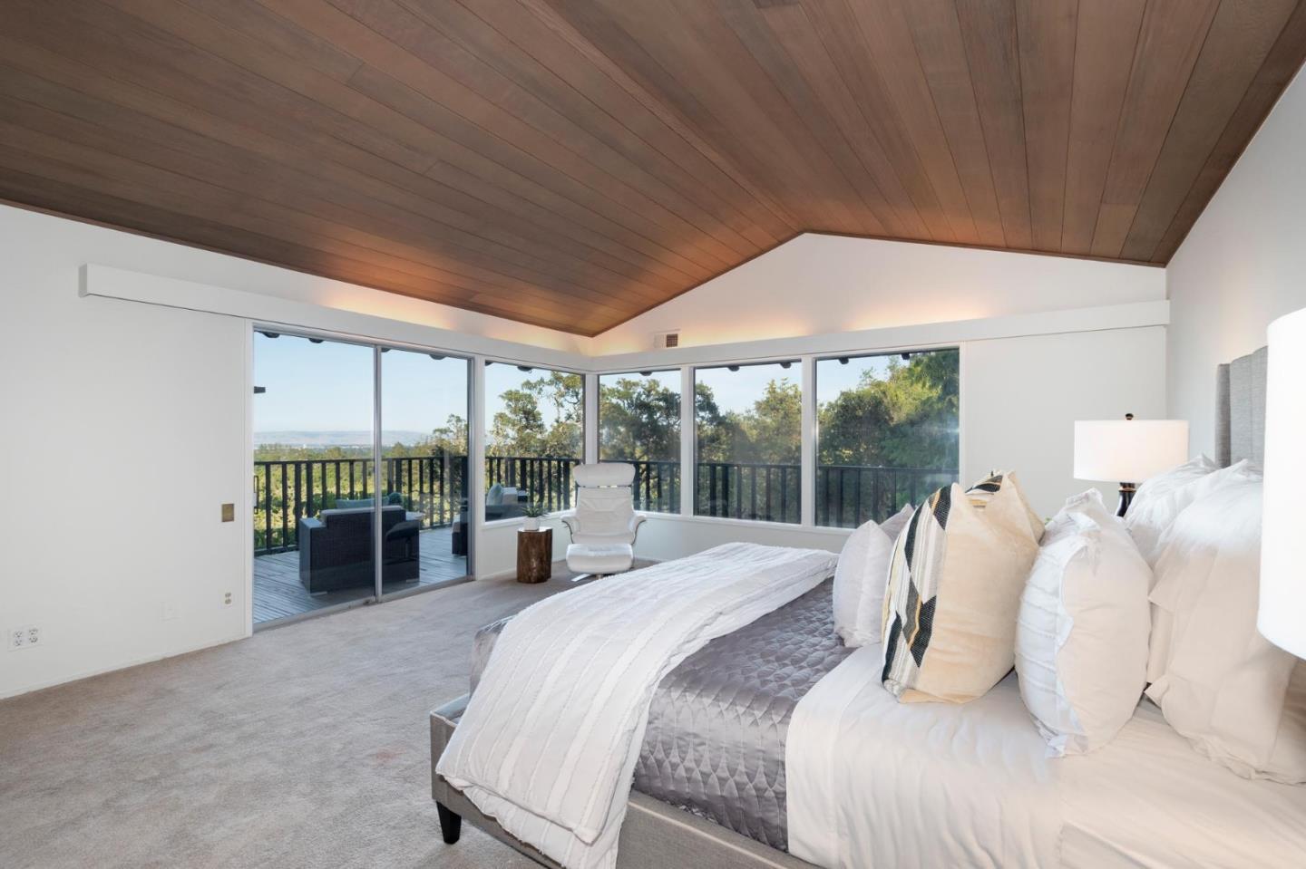 210 Hardwick Road Woodside, CA 94062 - Photo 19 of 29 a bedroom with furniture and a large window