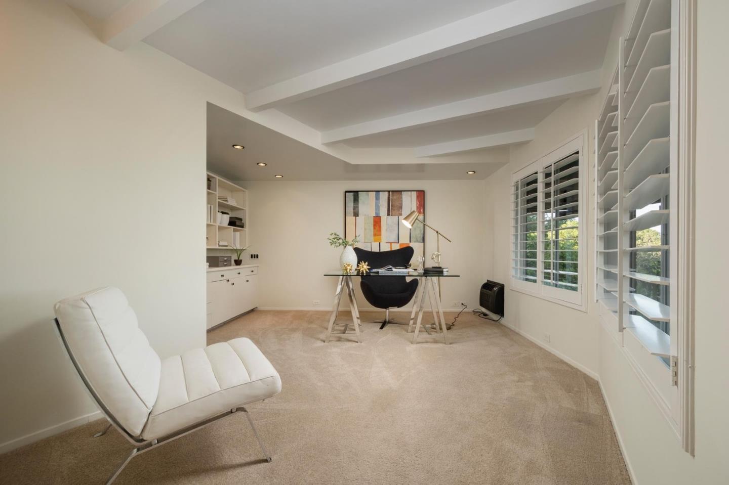 210 Hardwick Road Woodside, CA 94062 - Photo 20 of 29 a living room with furniture a rug and a large window