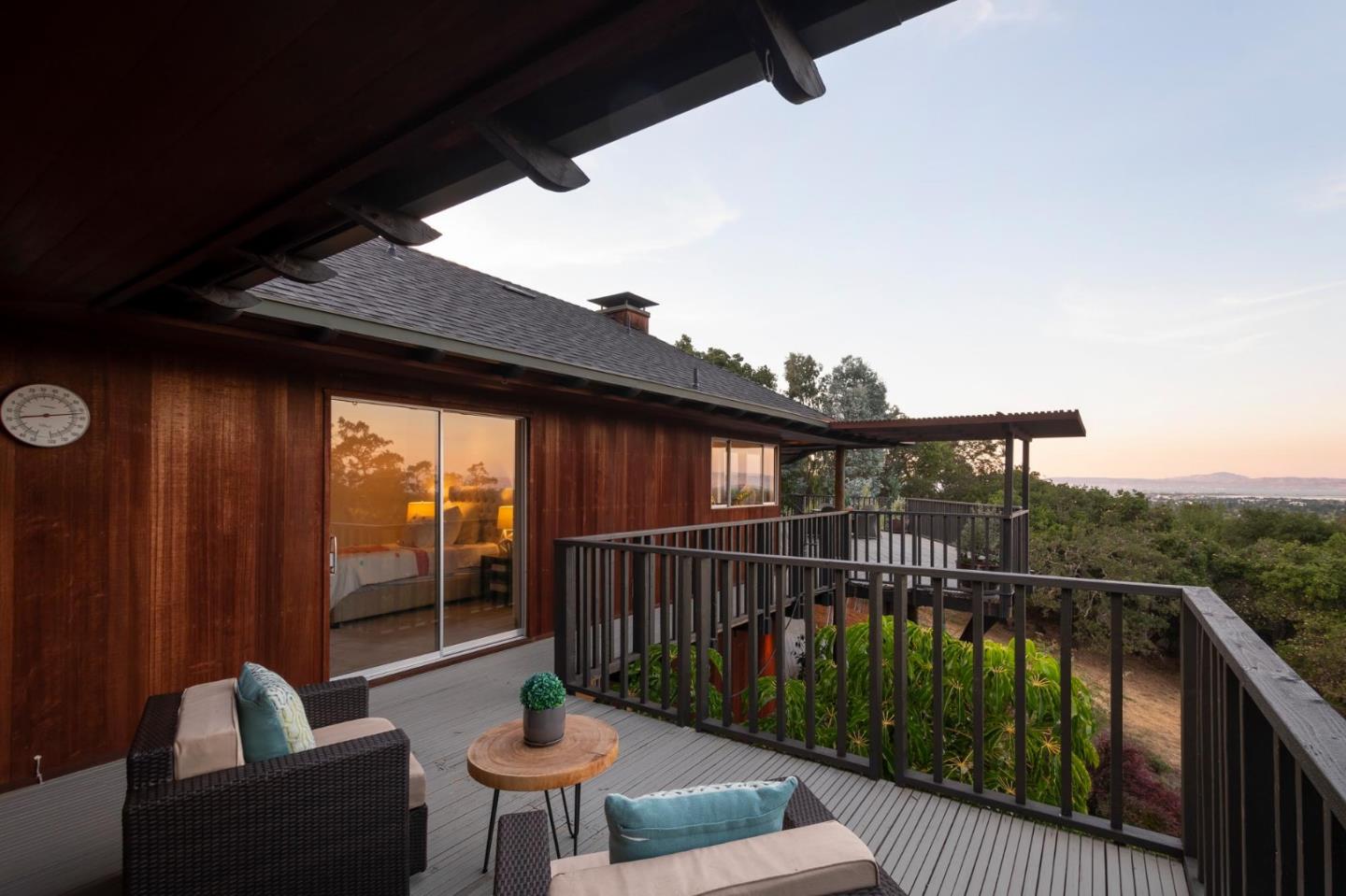 210 Hardwick Road Woodside, CA 94062 - Photo 24 of 29 a balcony with table and chairs
