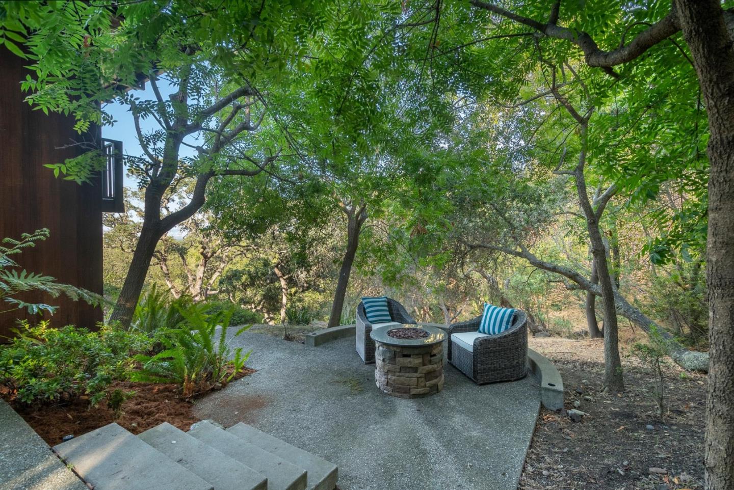 210 Hardwick Road Woodside, CA 94062 - Photo 29 of 29 a view of a patio with table and chairs and potted plants