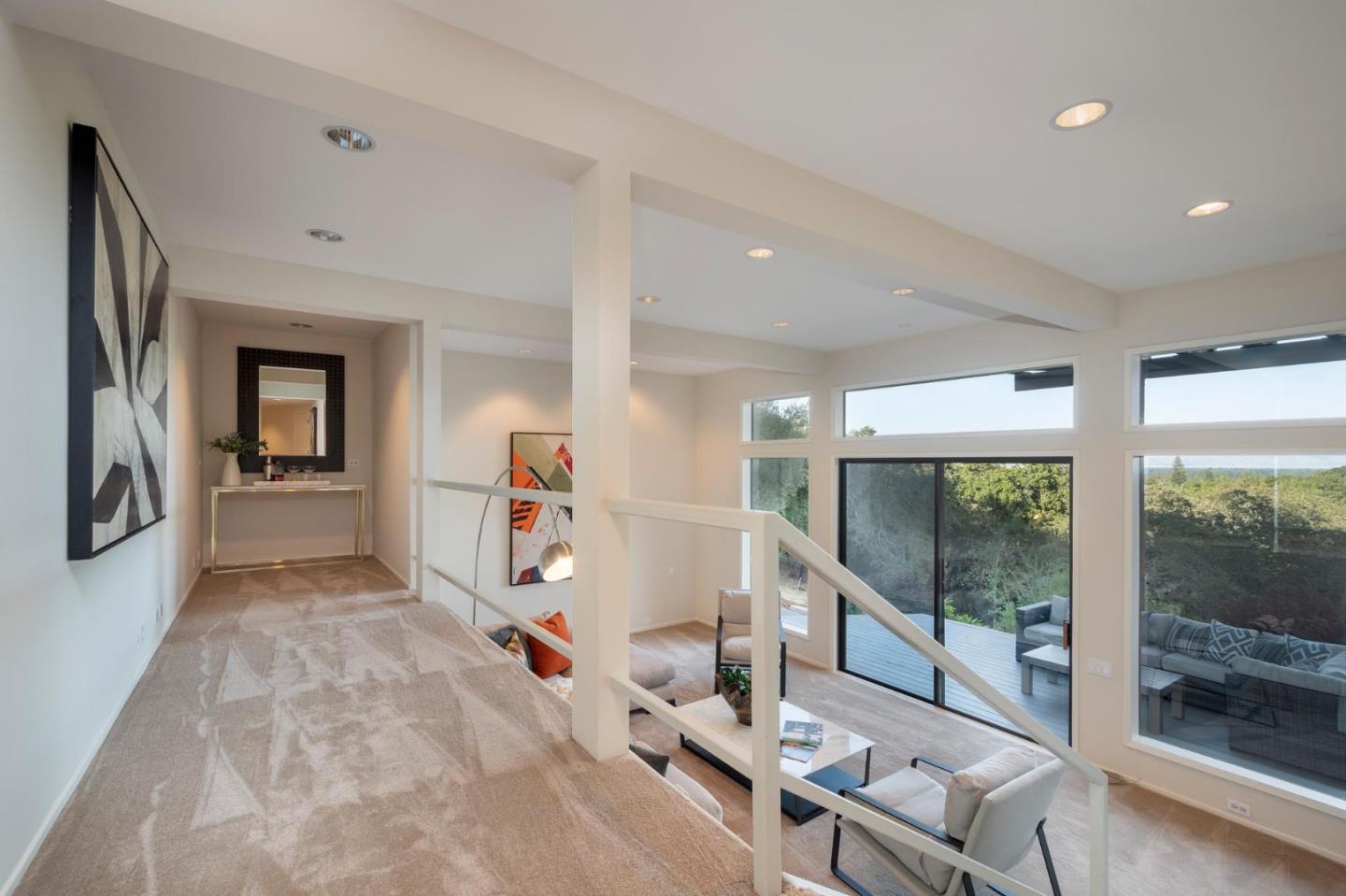 210 Hardwick Road Woodside, CA 94062 - Photo 6 of 29 a living room with furniture a flat screen tv and a large window