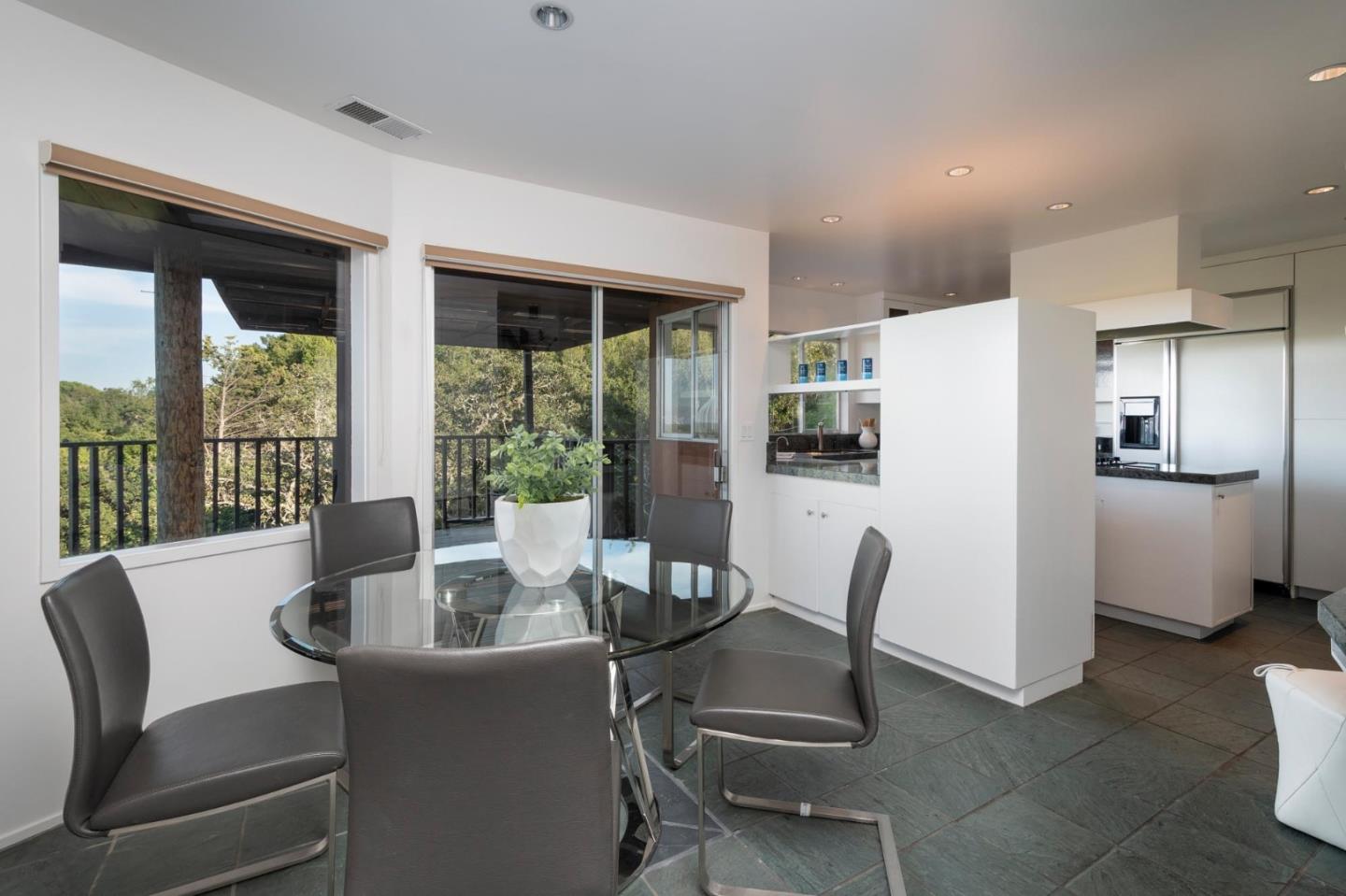 210 Hardwick Road Woodside, CA 94062 - Photo 8 of 29 a dining room with furniture and a floor to ceiling window