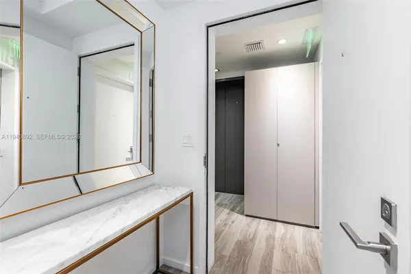 a view of kitchen with furniture and wooden floor