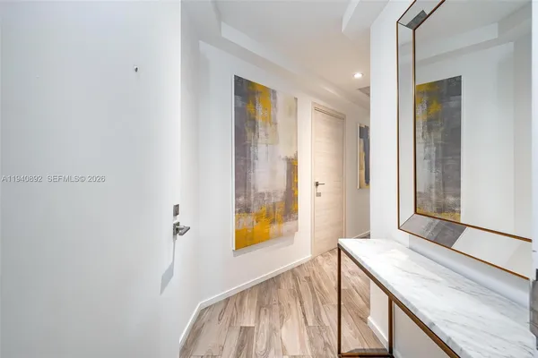 a view of a bathroom from a hallway