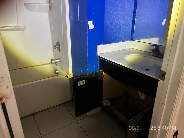 a bathroom with a sink and vanity