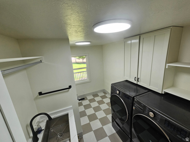 812 East Bates Cyn Road Tooele, UT 84074 - Photo 48 of 144 Functional utility space featuring checkerboard tile flooring, built-in cabinetry, an integrated sink with a matte black faucet, and overhead shelving