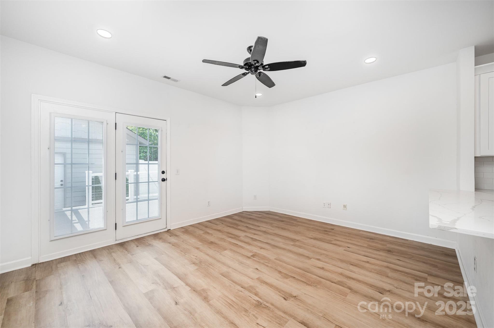 1135 Market Street Fort Mill, SC 29708 - Photo 14 of 36 wooden floor in an empty room with a window