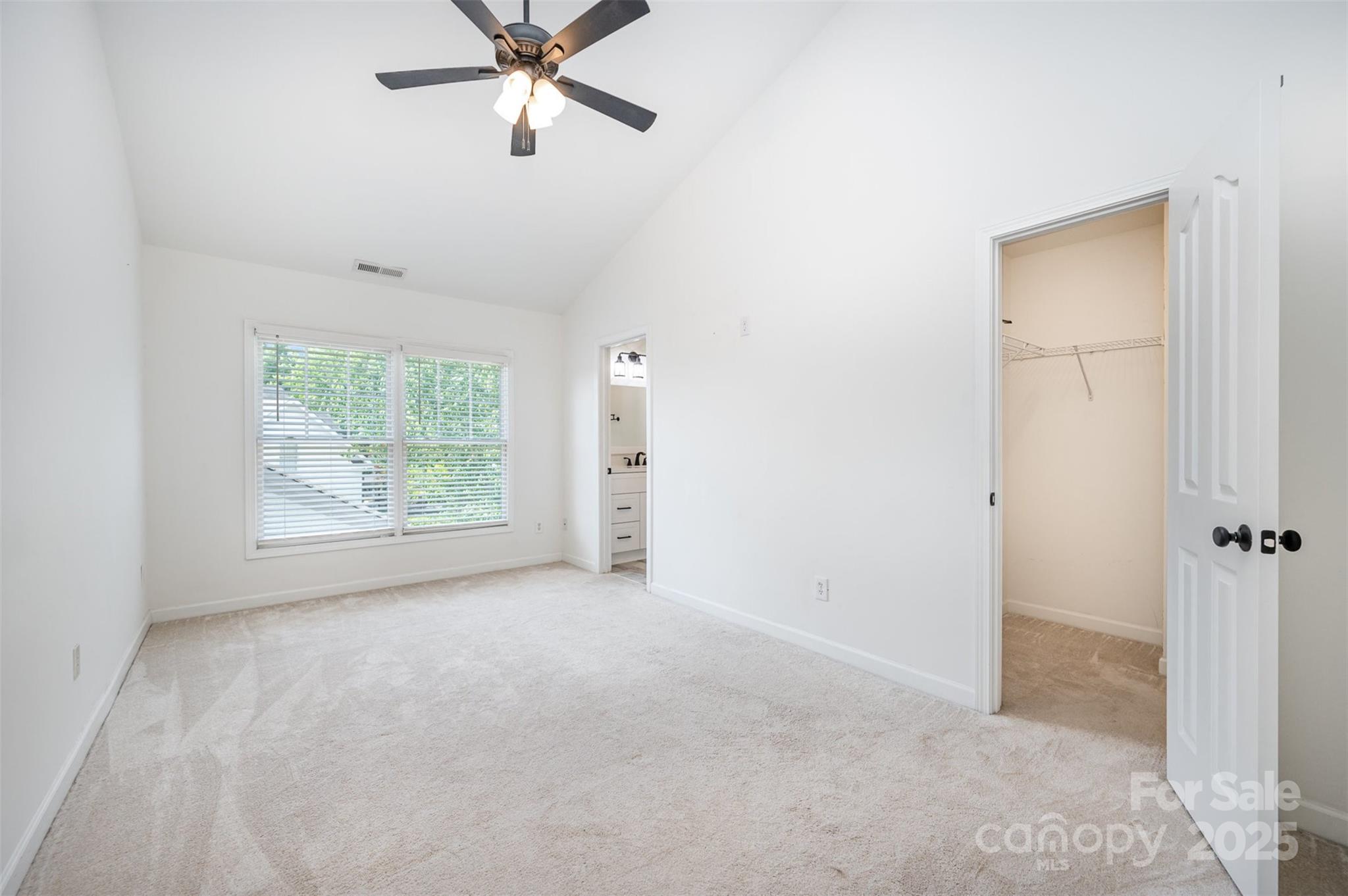 1135 Market Street Fort Mill, SC 29708 - Photo 17 of 36 an empty room with windows and fan