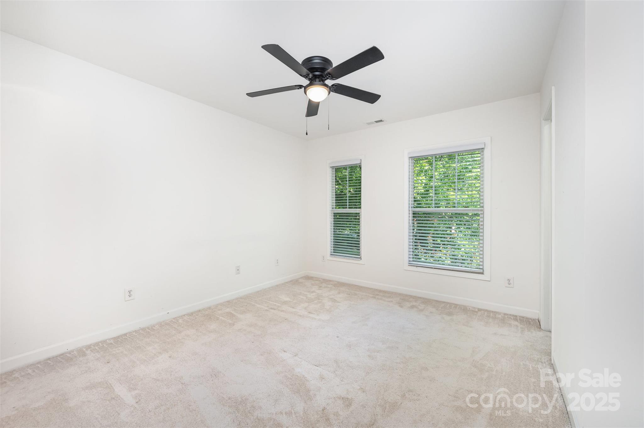 1135 Market Street Fort Mill, SC 29708 - Photo 22 of 36 an empty room with ceiling fan and window