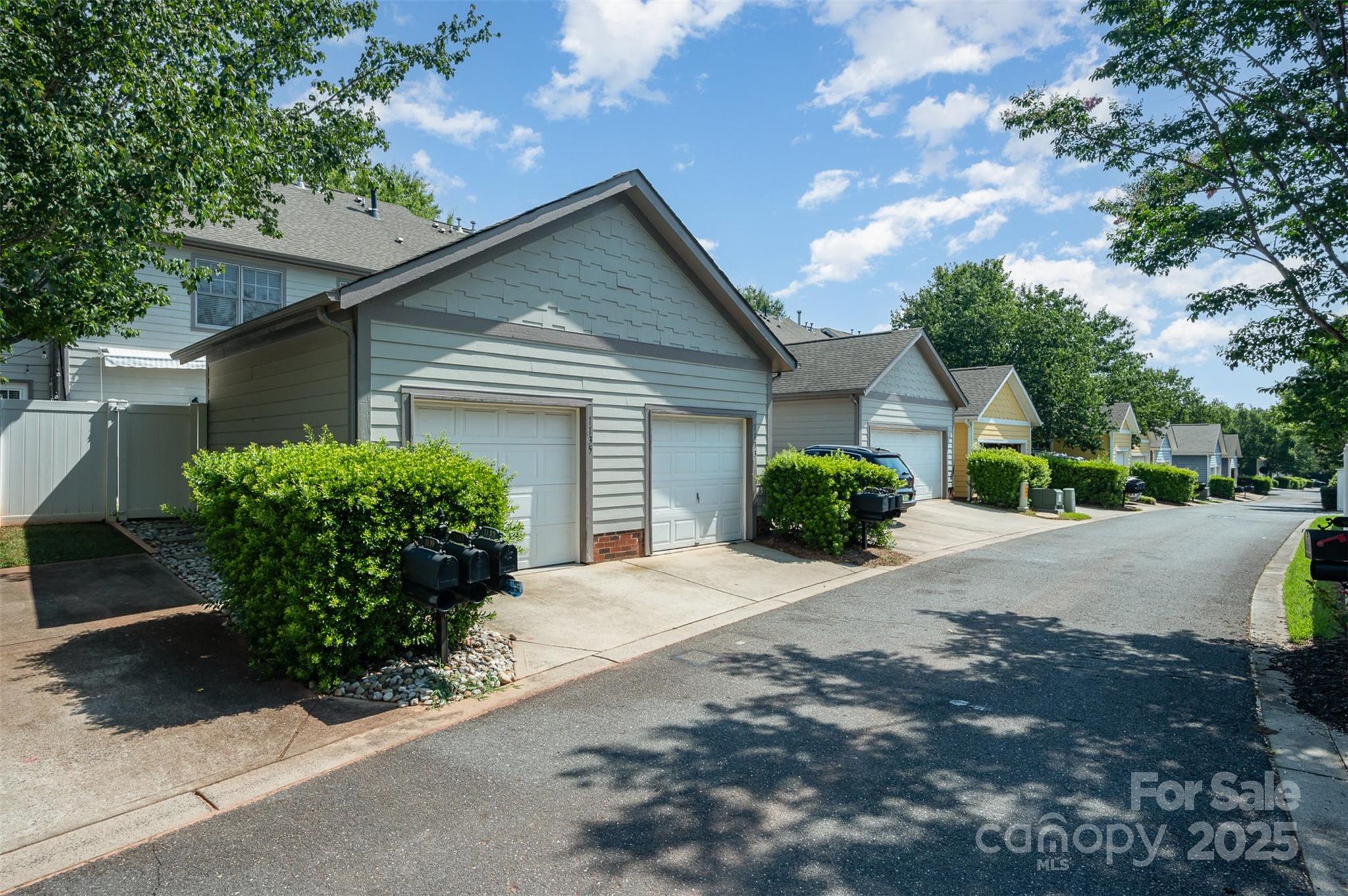 1135 Market Street Fort Mill, SC 29708 - Photo 28 of 36 a front view of a house with a yard and garage