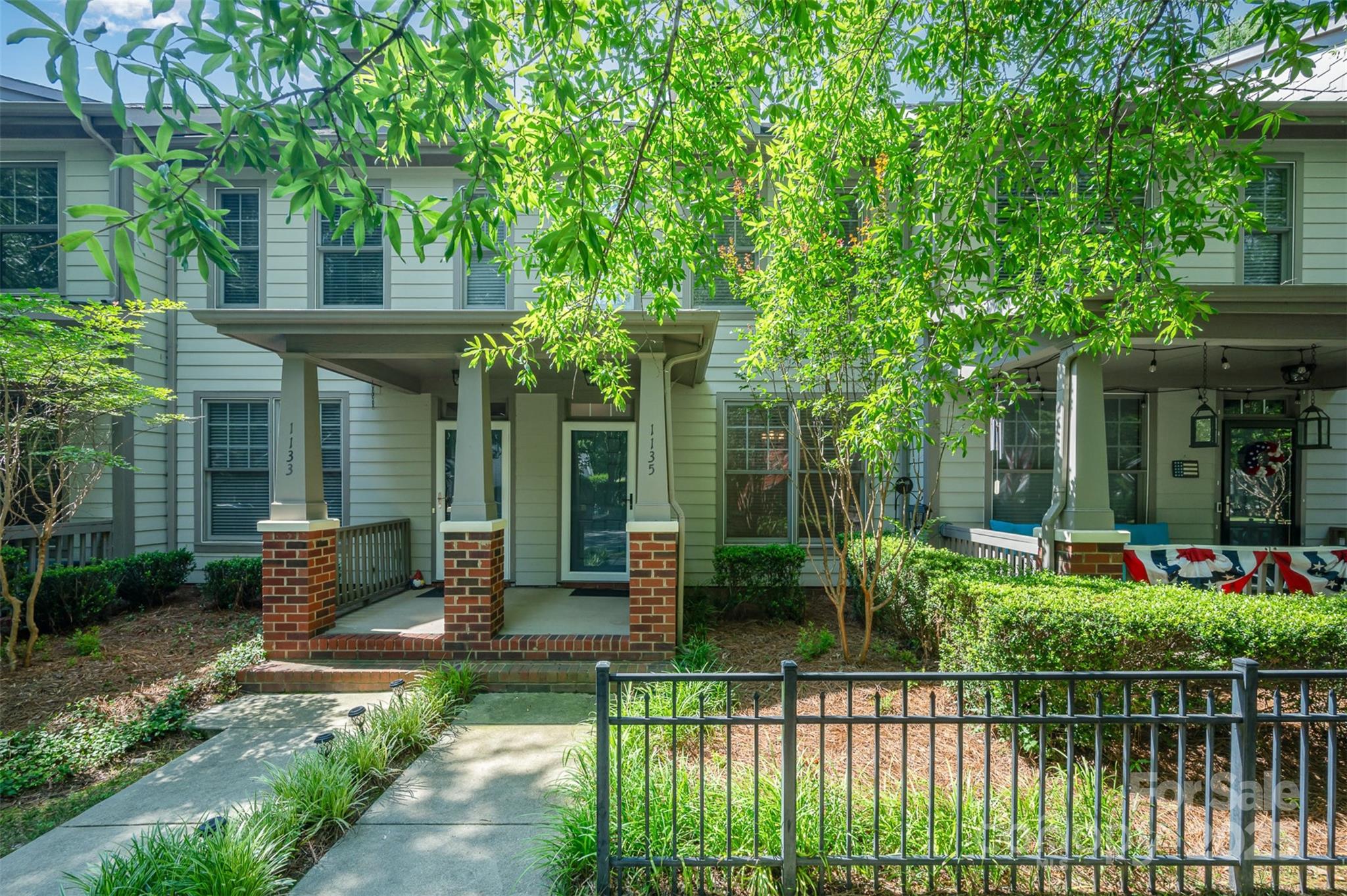 1135 Market Street Fort Mill, SC 29708 - Photo 3 of 36 a front view of a house with plants and large tree