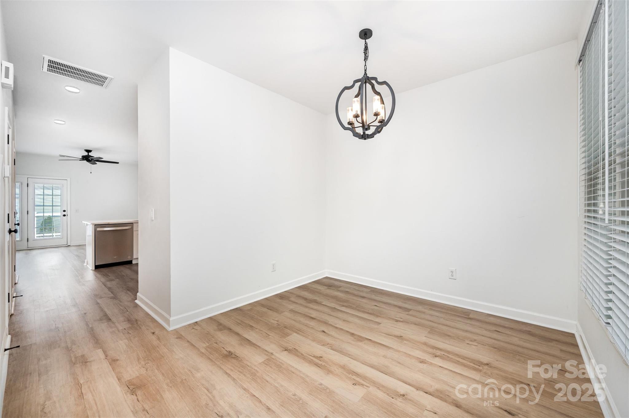 1135 Market Street Fort Mill, SC 29708 - Photo 8 of 36 a view of a room with wooden floor and white walls