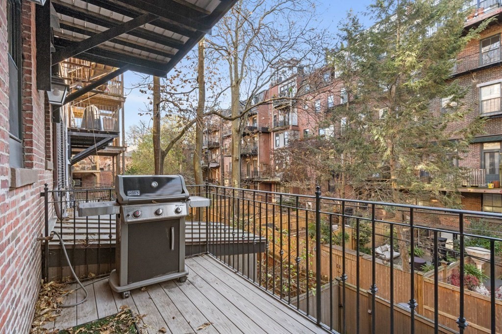 34 Dwight Street, Unit 1 Boston, MA 02118 - Photo 13 of 40 a view of a balcony with wooden floor and fence