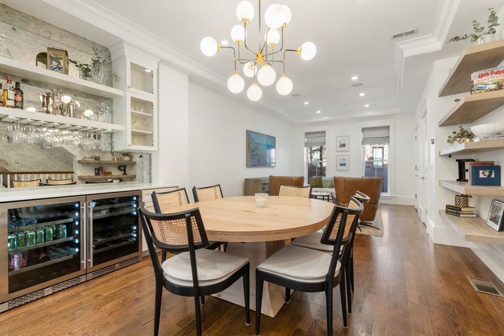 34 Dwight Street, Unit 1 Boston, MA 02118 - Photo 16 of 40 a view of a dining room with furniture and wooden floor