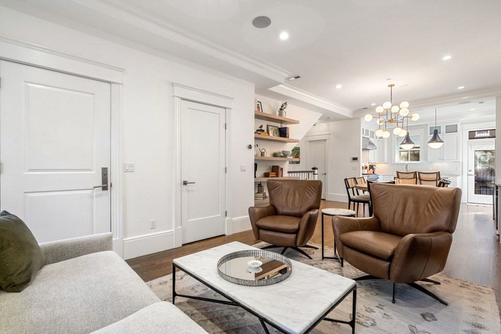 34 Dwight Street, Unit 1 Boston, MA 02118 - Photo 18 of 40 a living room with furniture and a table