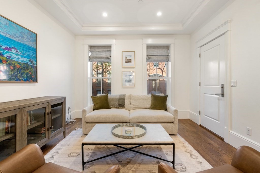 34 Dwight Street, Unit 1 Boston, MA 02118 - Photo 2 of 40 a living room with furniture and a fireplace