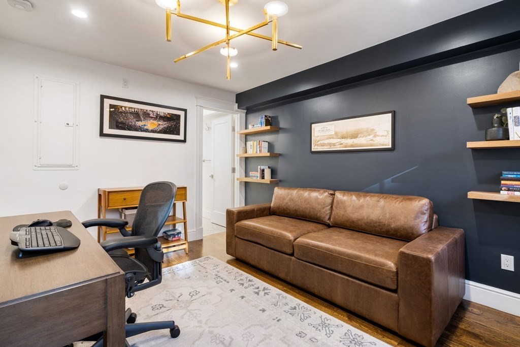 34 Dwight Street, Unit 1 Boston, MA 02118 - Photo 26 of 40 a living room with furniture and a flat screen tv