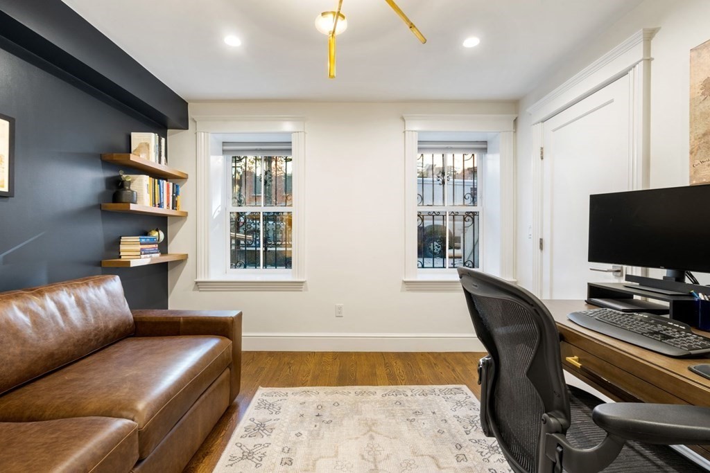 34 Dwight Street, Unit 1 Boston, MA 02118 - Photo 27 of 40 a living room with furniture and a flat screen tv