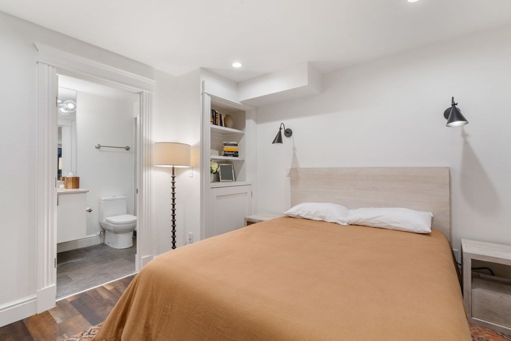 34 Dwight Street, Unit 1 Boston, MA 02118 - Photo 30 of 40 a bedroom with a bed and a view of bathroom