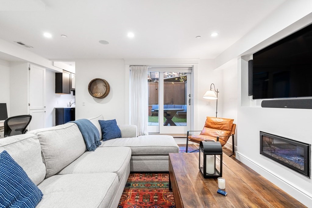 34 Dwight Street, Unit 1 Boston, MA 02118 - Photo 3 of 40 a living room with furniture and a flat screen tv