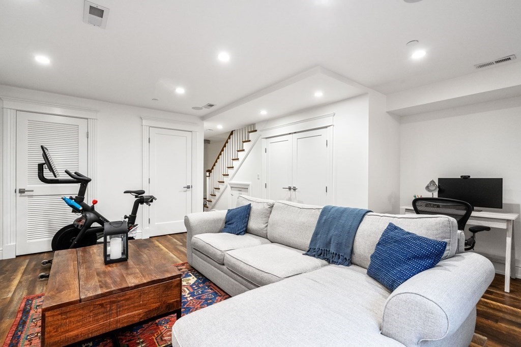 34 Dwight Street, Unit 1 Boston, MA 02118 - Photo 32 of 40 a living room with furniture and a flat screen tv