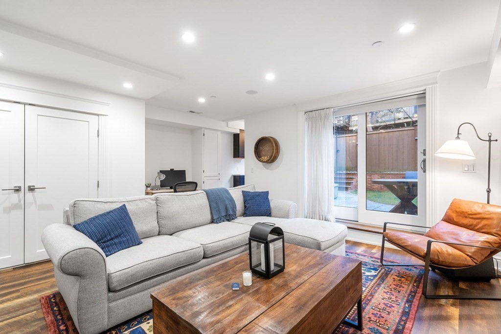 34 Dwight Street, Unit 1 Boston, MA 02118 - Photo 33 of 40 a living room with furniture and a large window
