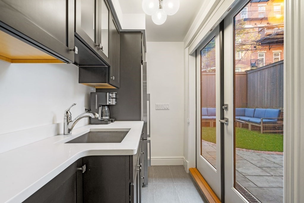 34 Dwight Street, Unit 1 Boston, MA 02118 - Photo 34 of 40 a bathroom with a sink and a mirror