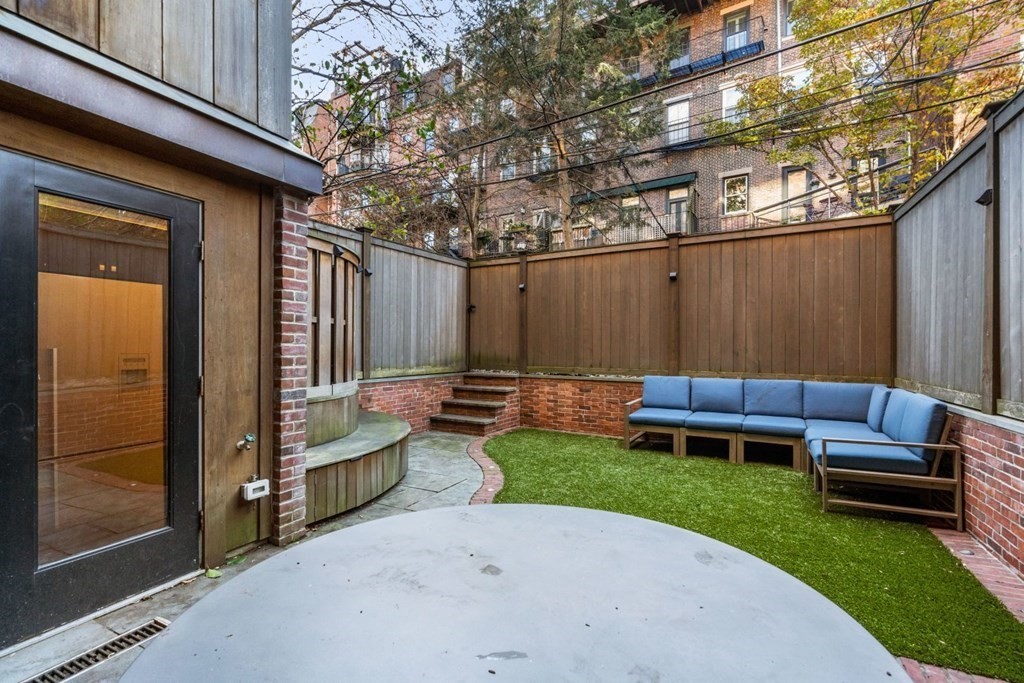34 Dwight Street, Unit 1 Boston, MA 02118 - Photo 35 of 40 a view of a backyard with couches and a patio