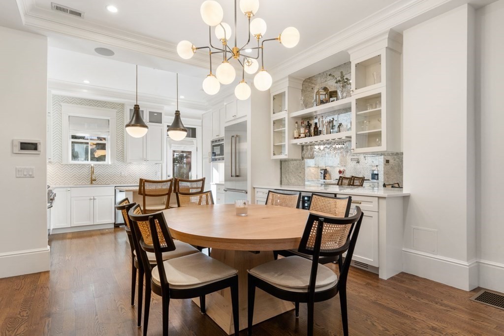 34 Dwight Street, Unit 1 Boston, MA 02118 - Photo 6 of 40 a view of a dining room with furniture and wooden floor
