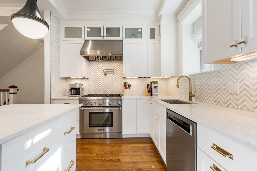 34 Dwight Street, Unit 1 Boston, MA 02118 - Photo 8 of 40 a kitchen with stainless steel appliances granite countertop a stove a sink and a microwave