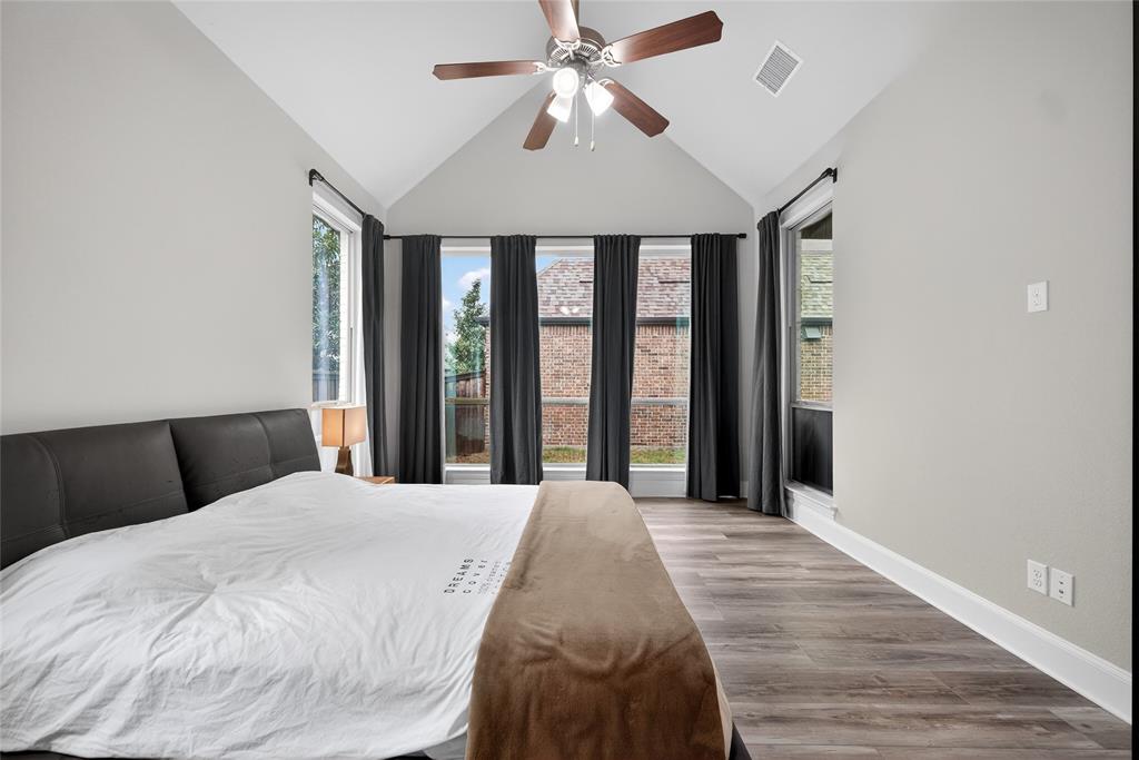 1039 Stephen Street Allen, TX 75013 - Photo 22 of 40 Bedroom featuring vaulted ceiling, wood finished floors, and ceiling fan
