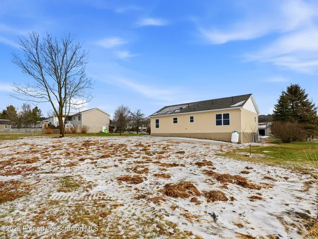 a big room with road and wooden fence