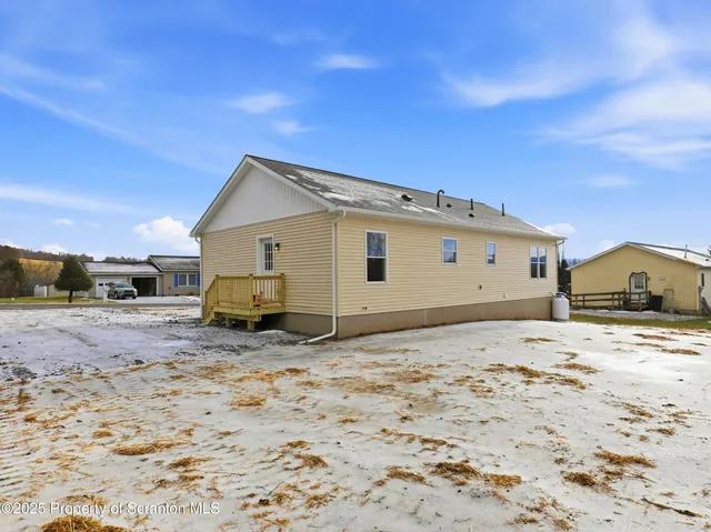 a view of a house with a dirt road