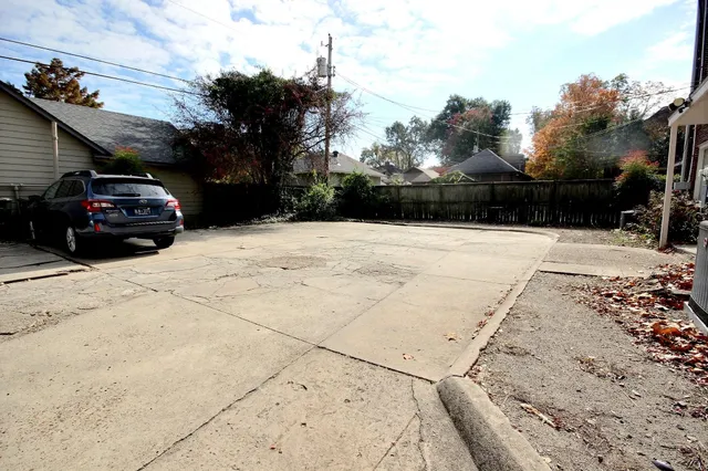 a kitchen with a black white checkered floor and a sink