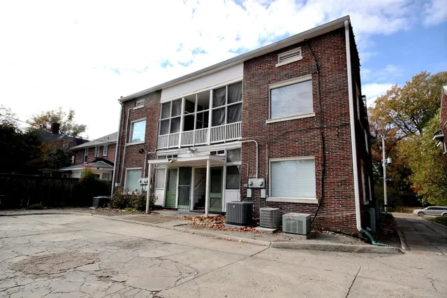 a kitchen with stainless steel appliances a sink and cabinets